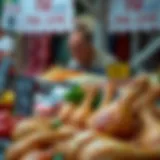 Fresh chicken drumsticks displayed on a market stall