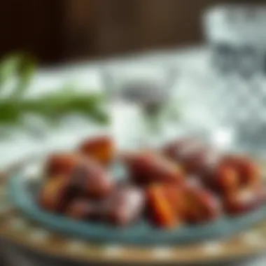 Dates and water on a decorative plate for breaking fast