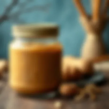 A jar of raw peanut butter spread on a wooden table