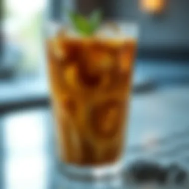 Refreshing cold coffee with ice in a stylish glass