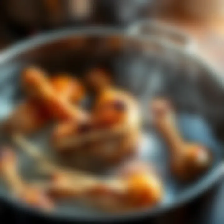 Chicken drumsticks simmering in a pot A pot filled with boiling water and chicken drumsticks