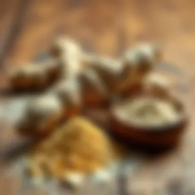 Fresh ginger roots and powdered ginger on a wooden surface